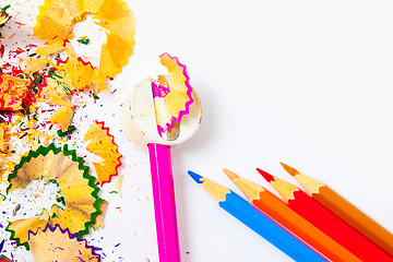 Image showing set of colored pencils, sharpener and shavings