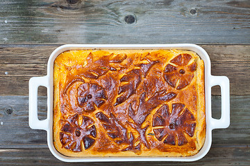 Image showing shred-pie in a white ceramic pot on vintage table