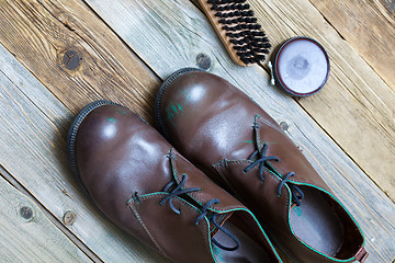 Image showing brown boots brush and shoe polish