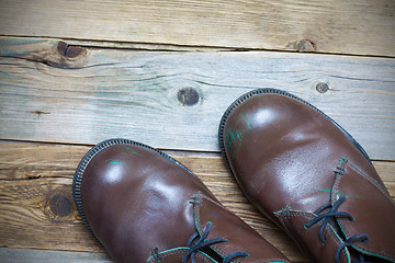 Image showing Two brown boots