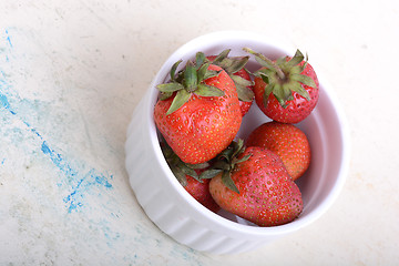Image showing Close up strawberry on old watercolor plate
