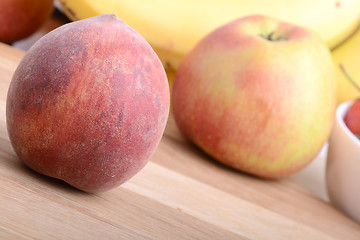 Image showing fruits on wodden table, peach, apple, bananas, food concept