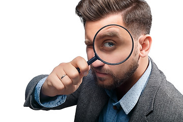 Image showing Man with magnifying glass on white background