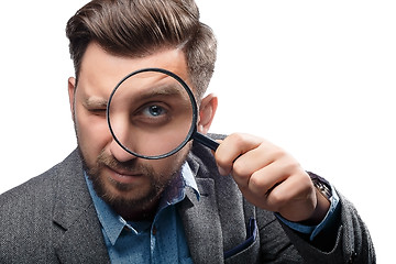 Image showing Man with magnifying glass on white background