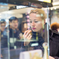 Image showing Beautiful woman shopping in beauty store.