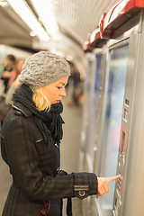 Image showing Lady buying ticket for public transport.