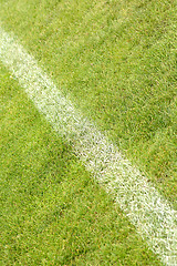 Image showing White stripe on the green soccer field from top view