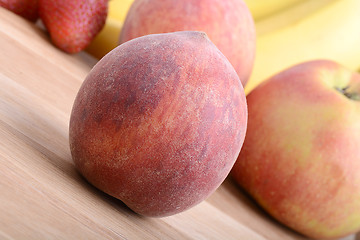 Image showing fruits on wooden table, peach, apple, bananas, food concept