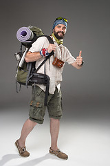 Image showing Full length portrait of a male fully equipped tourist 