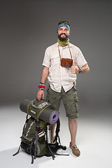 Image showing Full length portrait of a male fully equipped tourist 