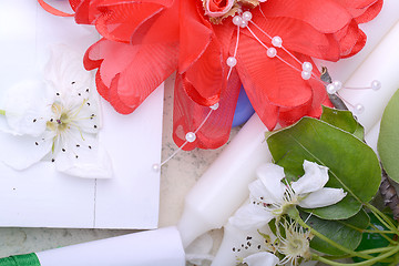 Image showing Office table with flower, ribbons, pencil, candles