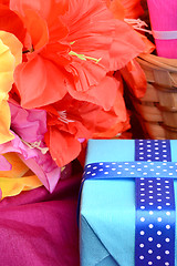 Image showing present gift box and flower bouquet on silk