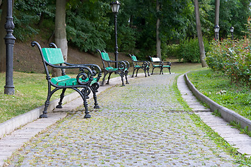 Image showing Park walkway of paving stones and benches.