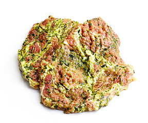 Image showing raw meat cuts in green marinade