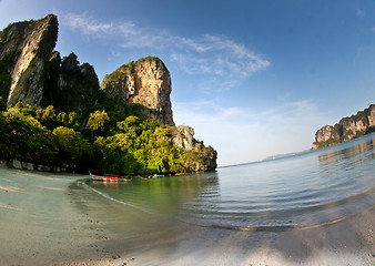 Image showing Long tail boat  at the beach in Railay Beach Thailand and rock i