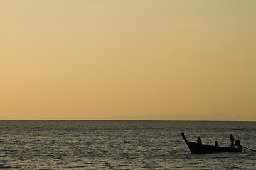 Image showing Silhouette of Long tail boat  in Railay Beach Thailand at sunset