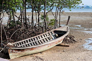 Image showing Abandonned Long tail boat  in Railay Beach Thailand