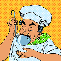 Image showing chef tastes food kitchen