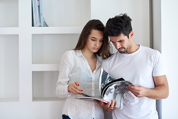 Image showing relaxed young couple at home staircase