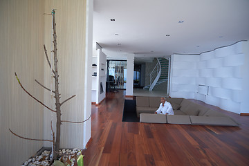 Image showing Portrait of senior man relaxing in sofa