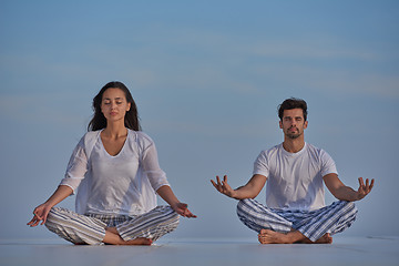 Image showing young couple practicing yoga