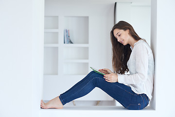 Image showing woman at home using tablet