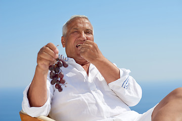 Image showing senior man sitting outside