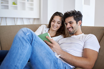 Image showing couple at modern home using tablet computer