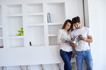 Image showing relaxed young couple at home staircase