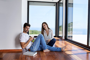 Image showing relaxed young couple at home staircase