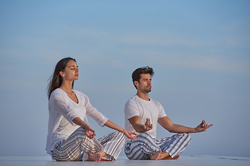 Image showing young couple practicing yoga