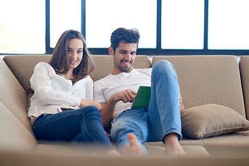 Image showing couple at modern home using tablet computer