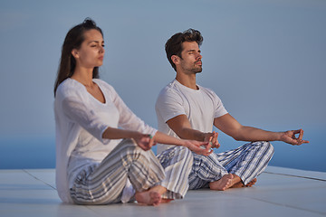 Image showing young couple practicing yoga