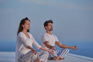 Image showing young couple practicing yoga