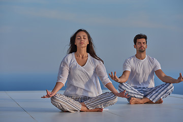 Image showing young couple practicing yoga