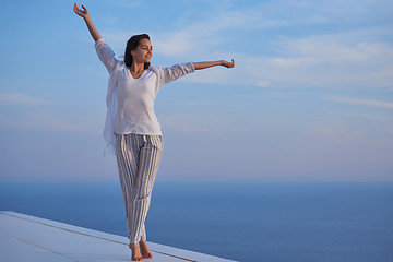 Image showing young woman enjoy sunset