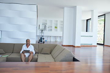 Image showing Portrait of senior man relaxing in sofa