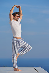 Image showing young man practicing yoga