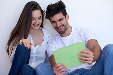 Image showing couple at modern home using tablet computer