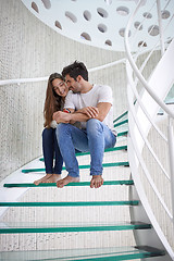 Image showing relaxed yung couple at home  stairs