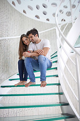 Image showing relaxed yung couple at home  stairs