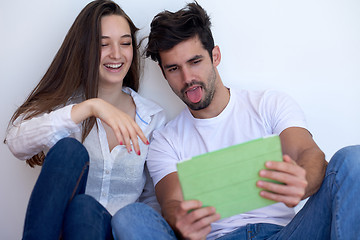 Image showing couple at modern home using tablet computer