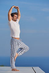 Image showing young man practicing yoga