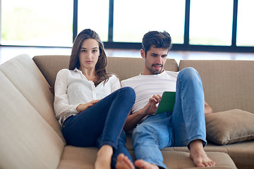 Image showing couple at modern home using tablet computer