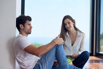 Image showing relaxed young couple at home staircase