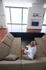 Image showing Portrait of senior man relaxing in sofa