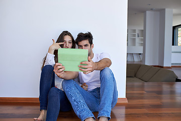 Image showing couple at modern home using tablet computer