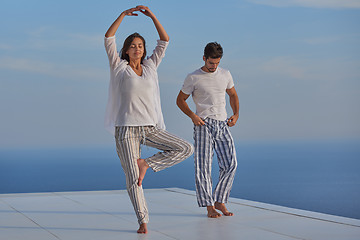 Image showing young couple practicing yoga