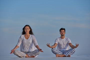 Image showing young couple practicing yoga