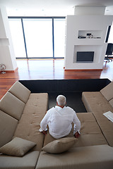 Image showing Portrait of senior man relaxing in sofa